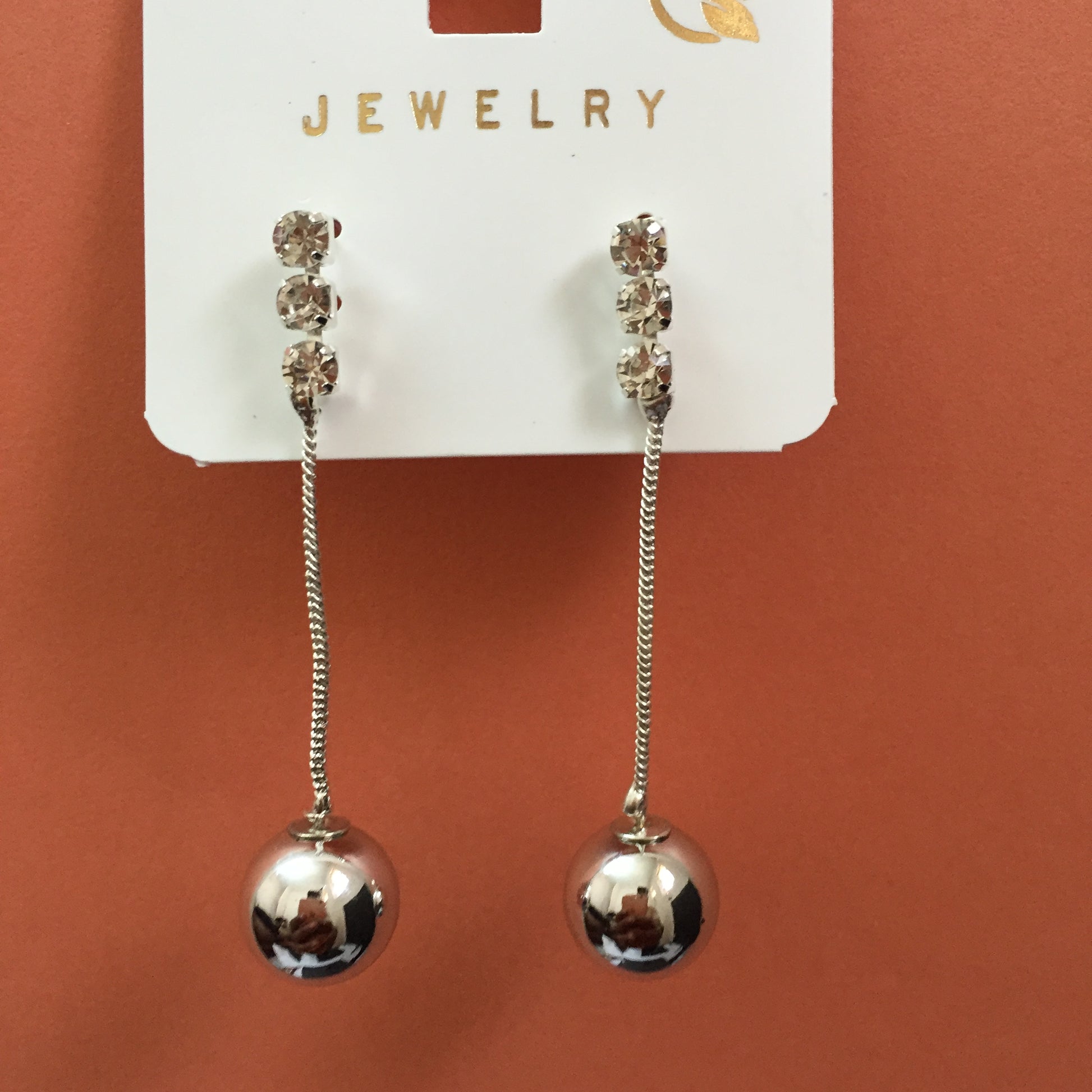 Silver long chain earrings with triple-stone stud and metallic ball drop – stylish women’s jewellery